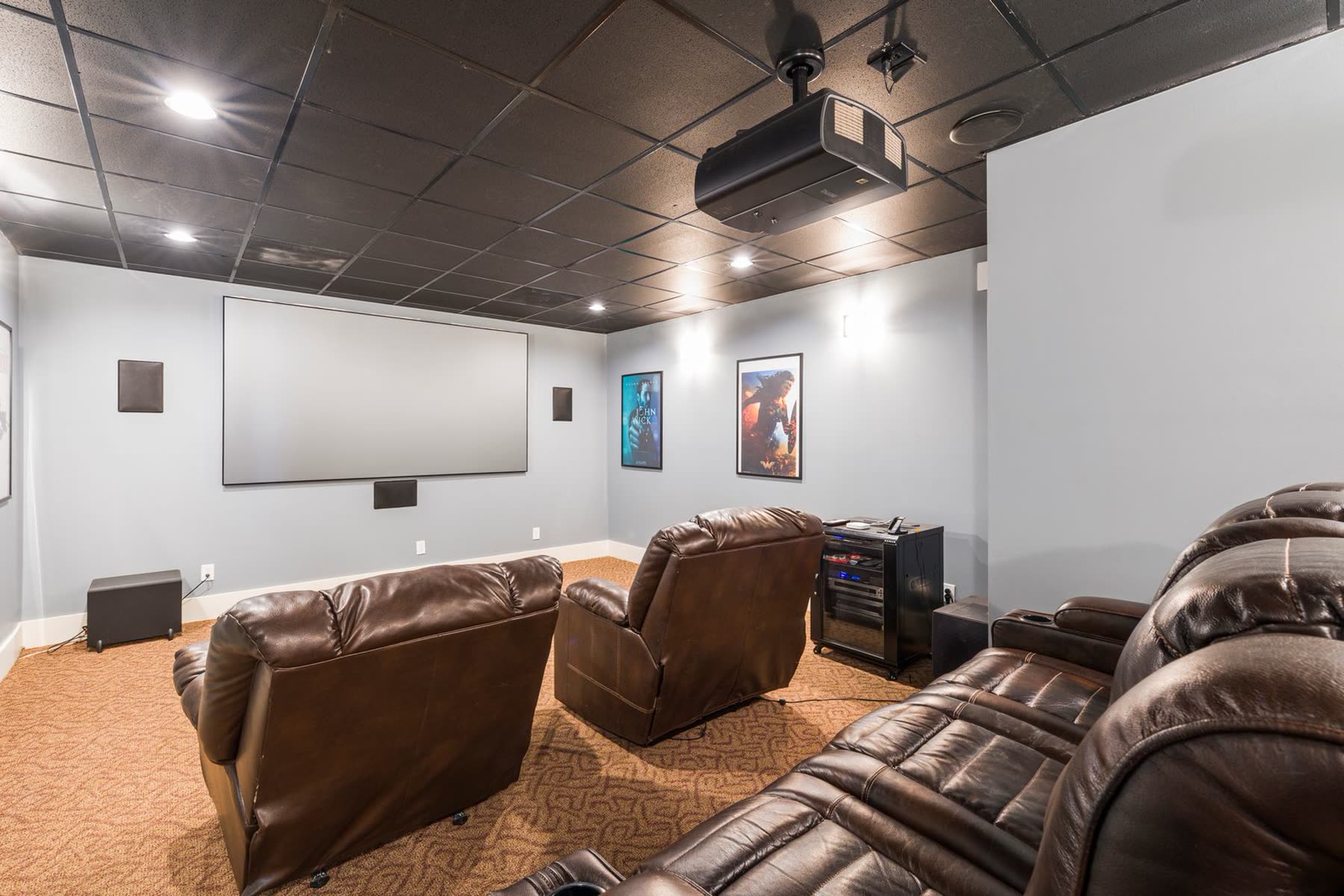 A modern home theater glowing in a dark room